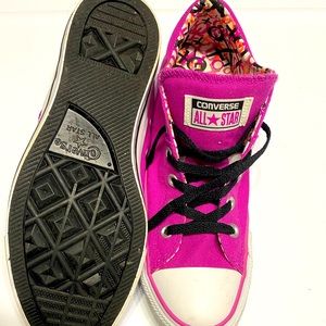 Chuck Taylor All Star Converse, Women’s size 10, Fuchsia in color.
